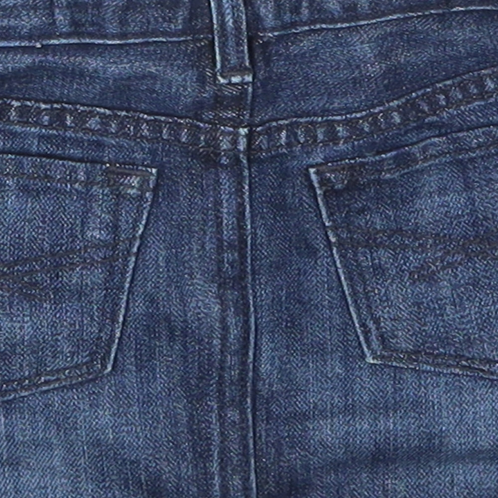 Brand and care label for Gap girls’ blue denim mini skirt, size 3, years