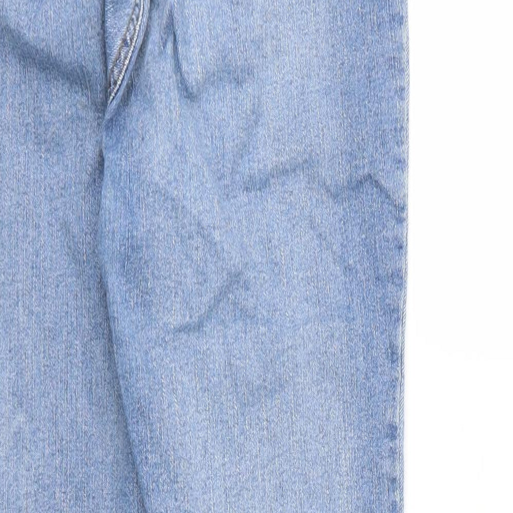 Brand and care label for PRETTYLITTLETHING women’s blue denim skinny jeans, size UK 12, 30-inch leg