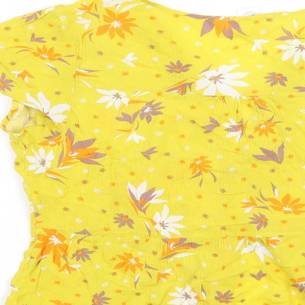 Brand and care label for Urban Romantics women’s yellow floral basic blouse, size L