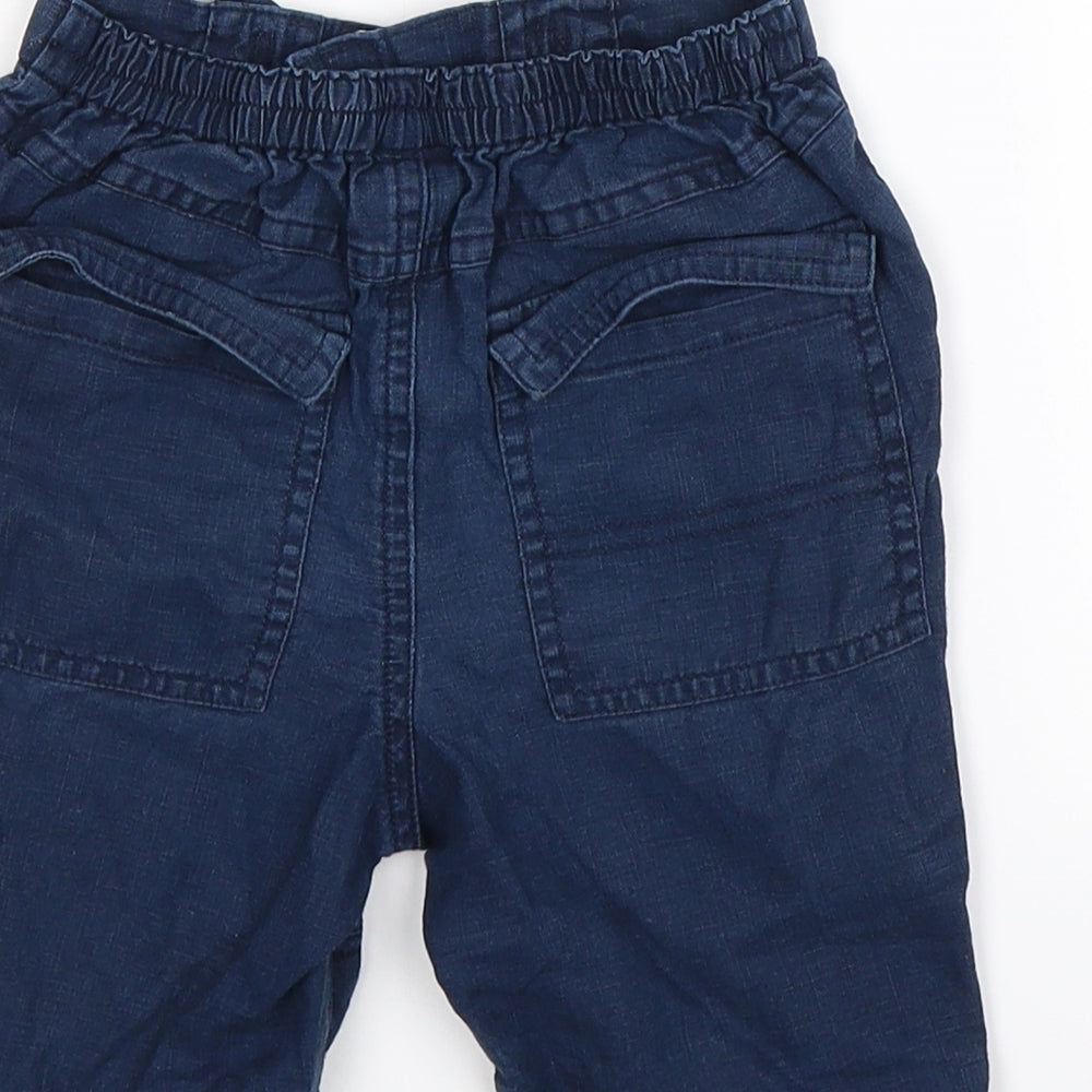 Brand and care label for Next boys’ blue bermuda shorts, size 2, years