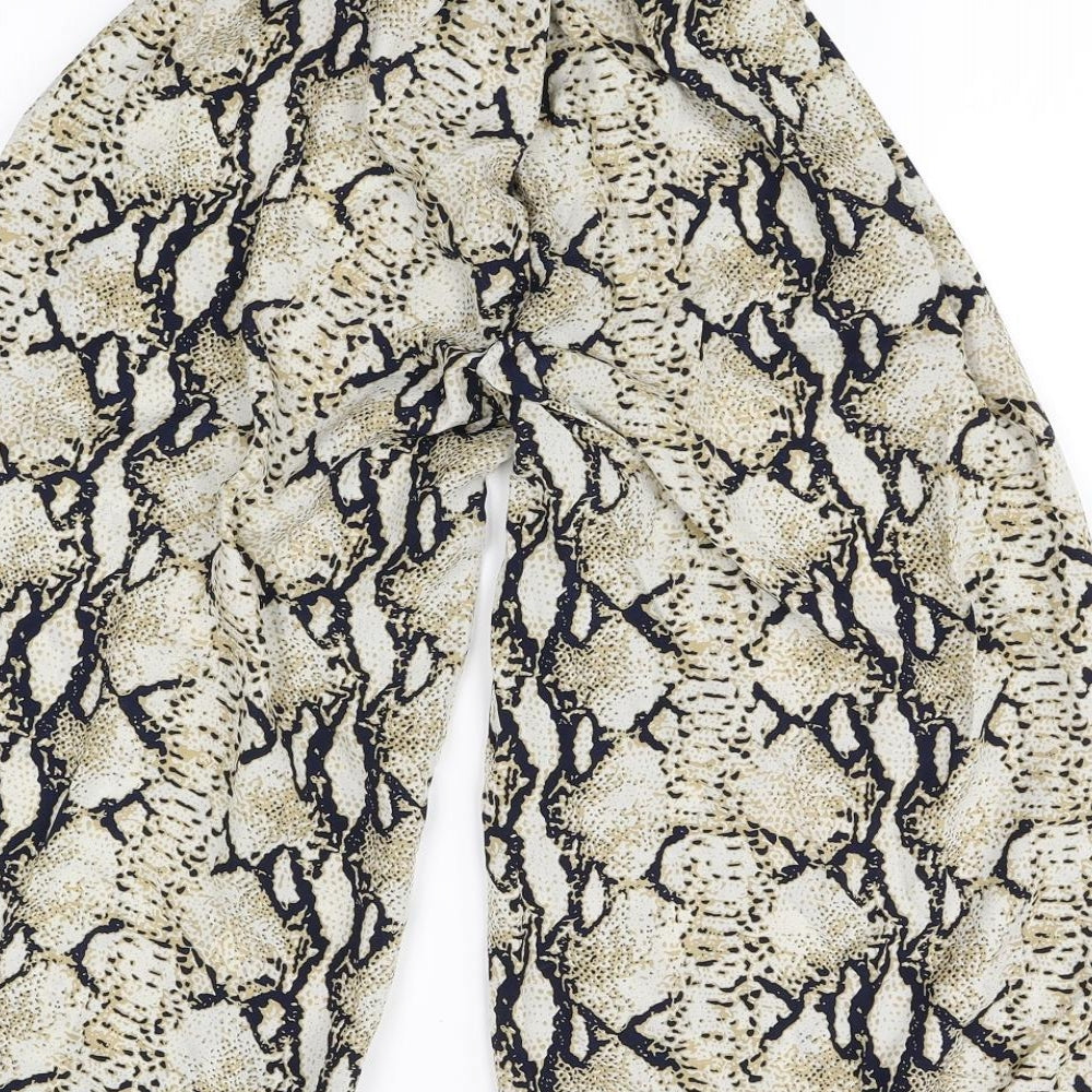 Brand and care label for Pink Vanilla women’s beige animal print trousers, size S, 25-inch leg