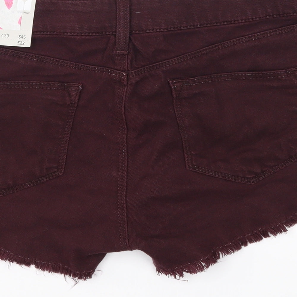 Brand and care label for Topshop women’s purple denim cut-off shorts, size UK 12