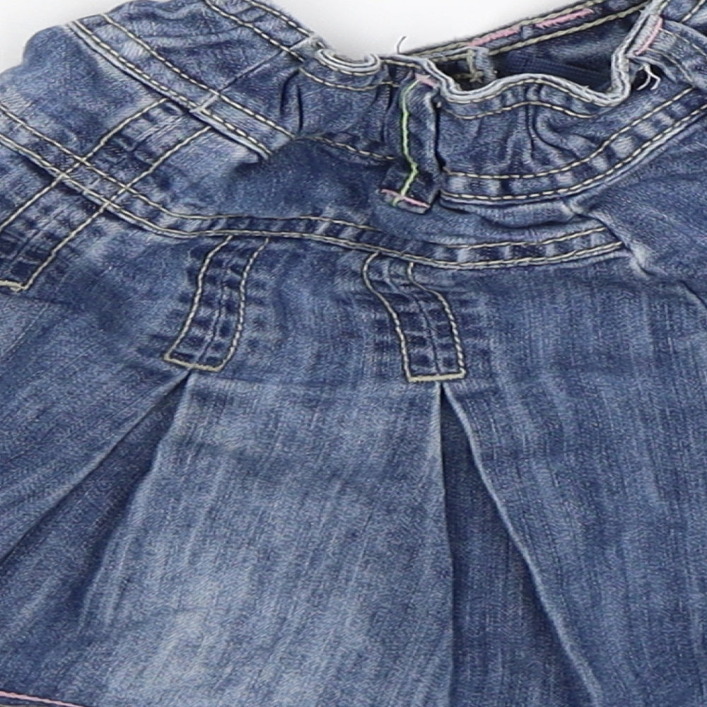 Brand and care label for Next girls’ blue denim flare skirt, size 3, years