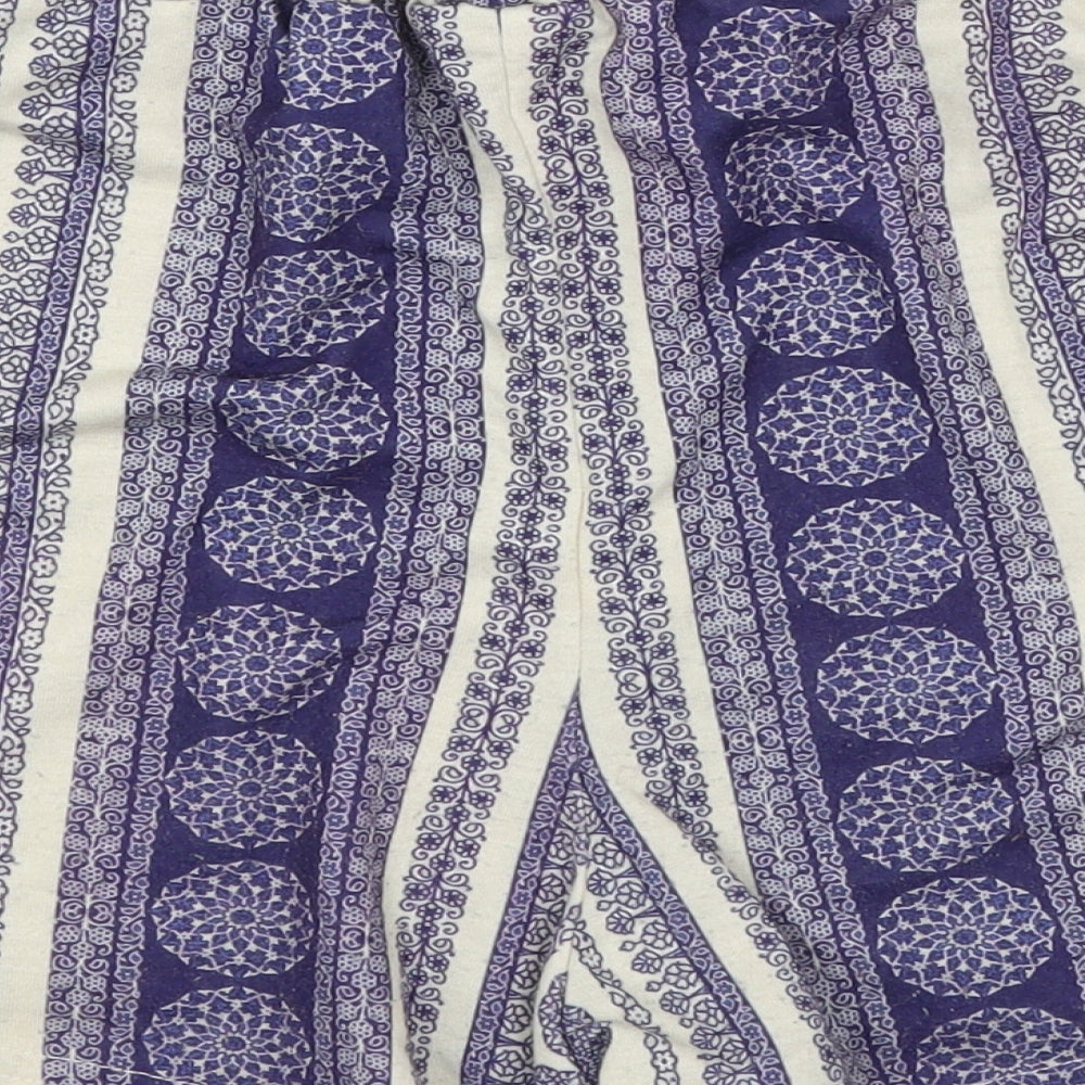 Brand and care label for Missguided women’s blue striped hot pants shorts, size UK 8