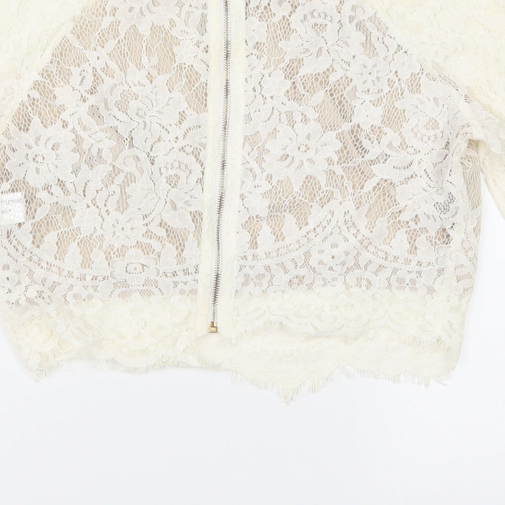 Brand and care label for PRETTYLITTLETHING women’s ivory cropped blouse, size UK 8