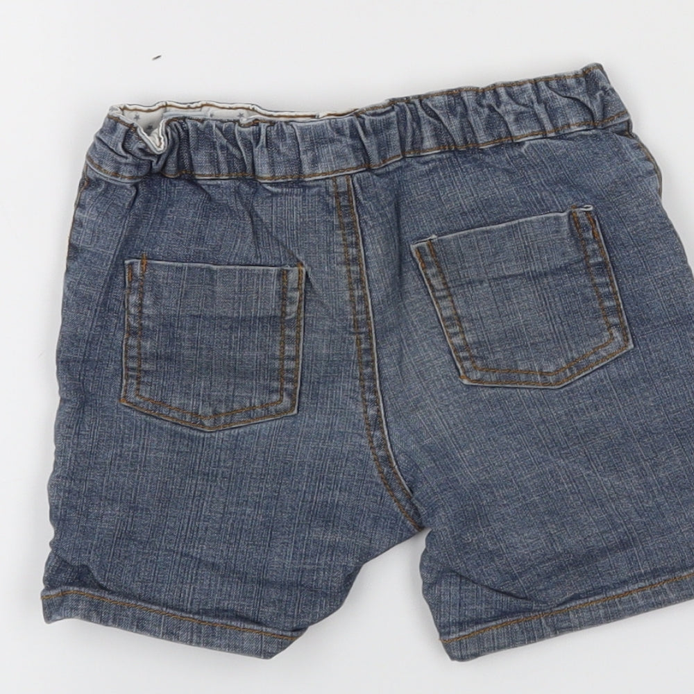 Brand and care label for Babies boys’ blue cropped jeans, size 12-18, months