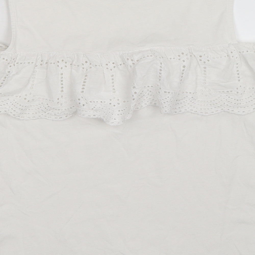 Brand and care label for Marks & Spencer women’s white floral basic tank, size XS