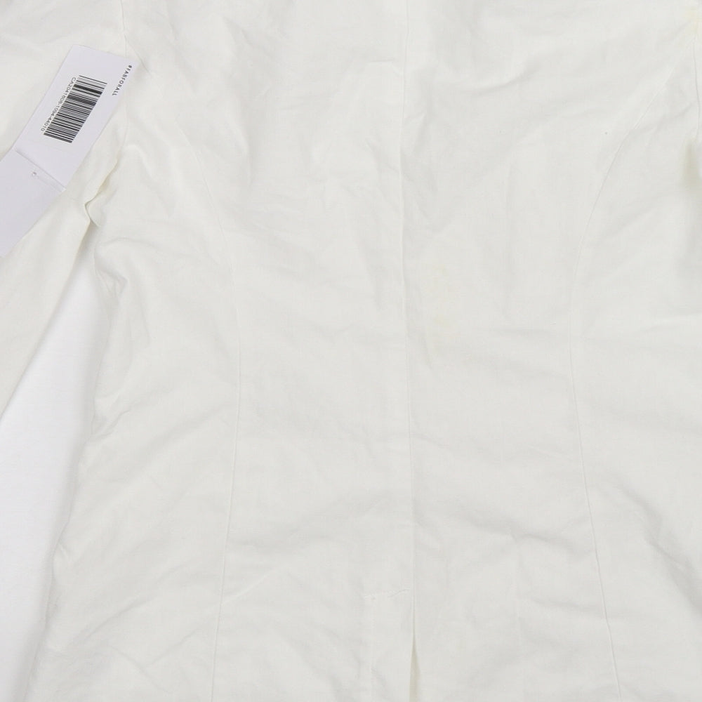 Brand and care label for JustFab women’s white jacket, size XS