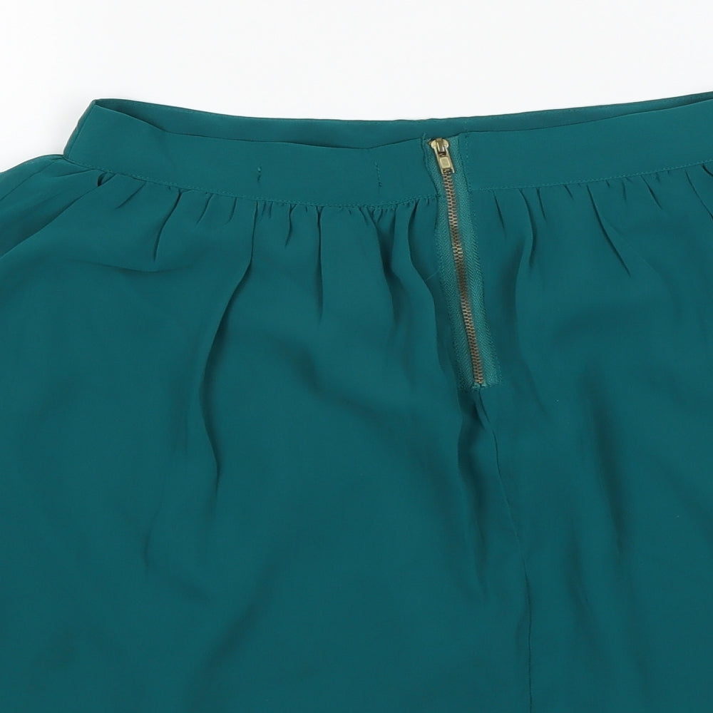 Brand and care label for Koton women’s green a-line skirt, size UK 6