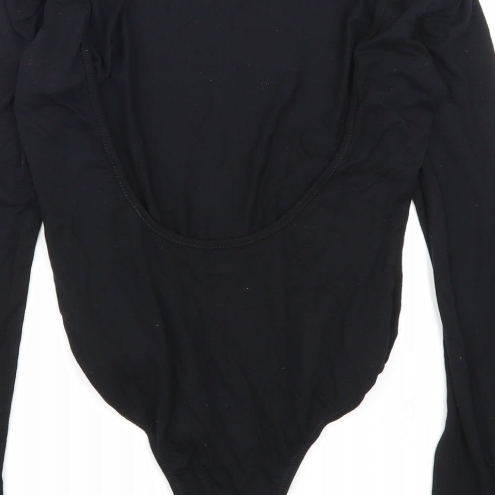 Brand and care label for Missguided women’s black bodysuit one-piece, size UK 8, - open back