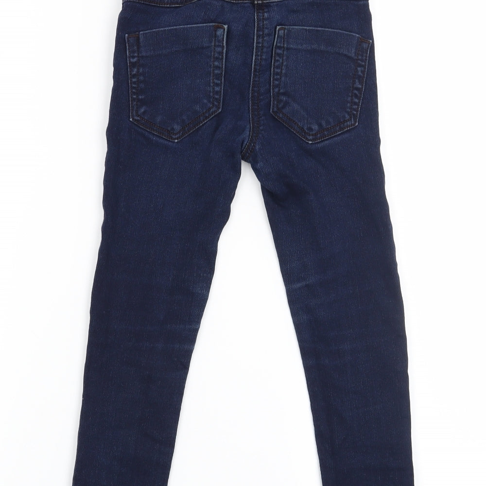 Brand and care label for Next girls’ blue straight jeans, size 6, years