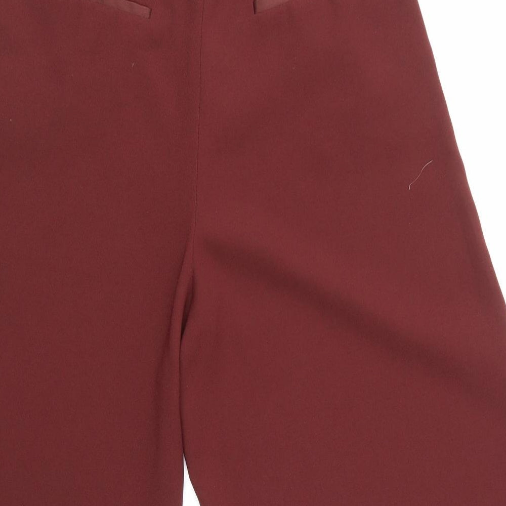 Brand and care label for Topshop women’s red mom shorts, size UK 8
