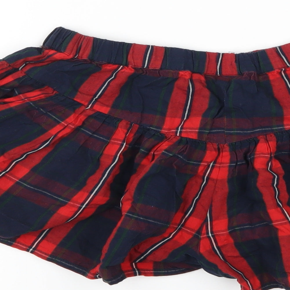 Brand and care label for Next girls’ red plaid hot pants shorts, size 8, years