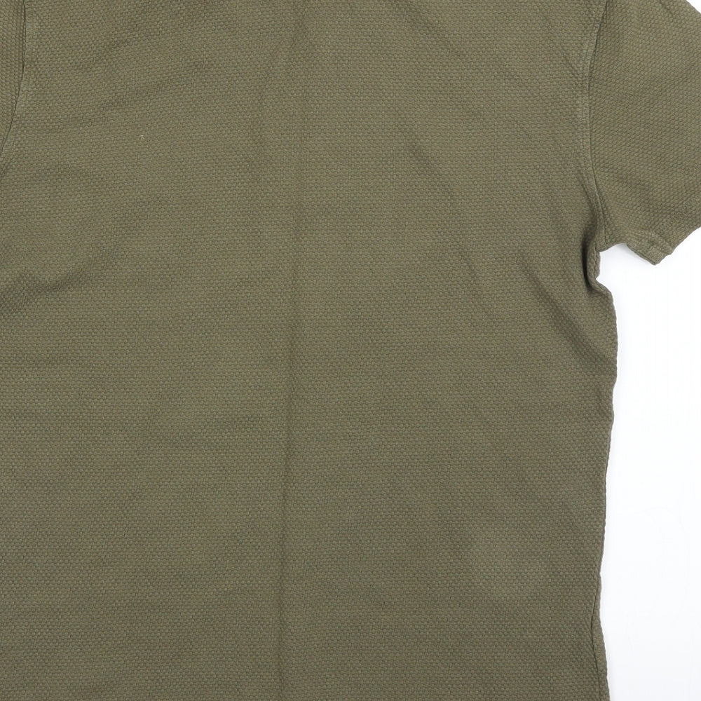 Brand and care label for New Look men’s green polo, size M