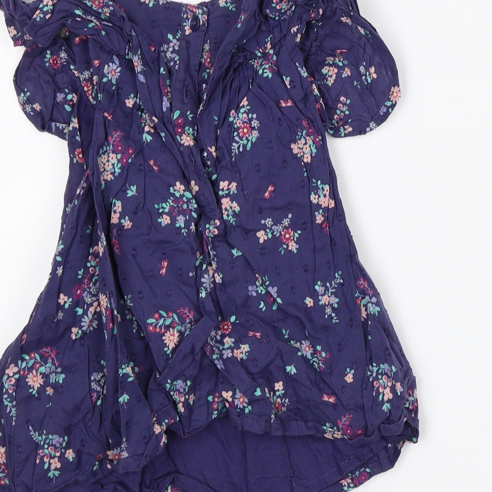 Brand and care label for Mothercare girls’ blue floral a-line, size 18-24, months