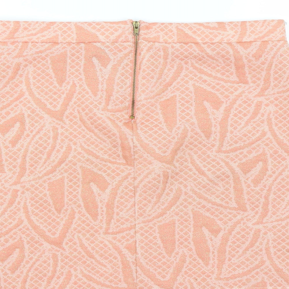 Brand and care label for H&M women’s pink floral mini skirt, size M