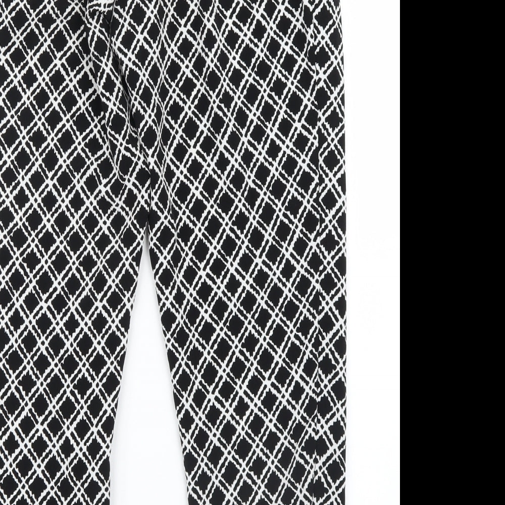 Brand and care label for Topshop women’s black geometric trousers, size UK 6, 27-inch leg