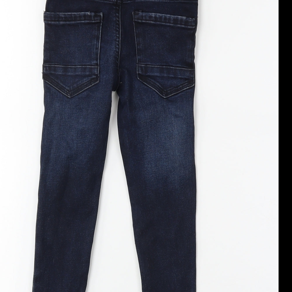 Brand and care label for Preworn boys’ blue denim skinny jeans, size 5, years