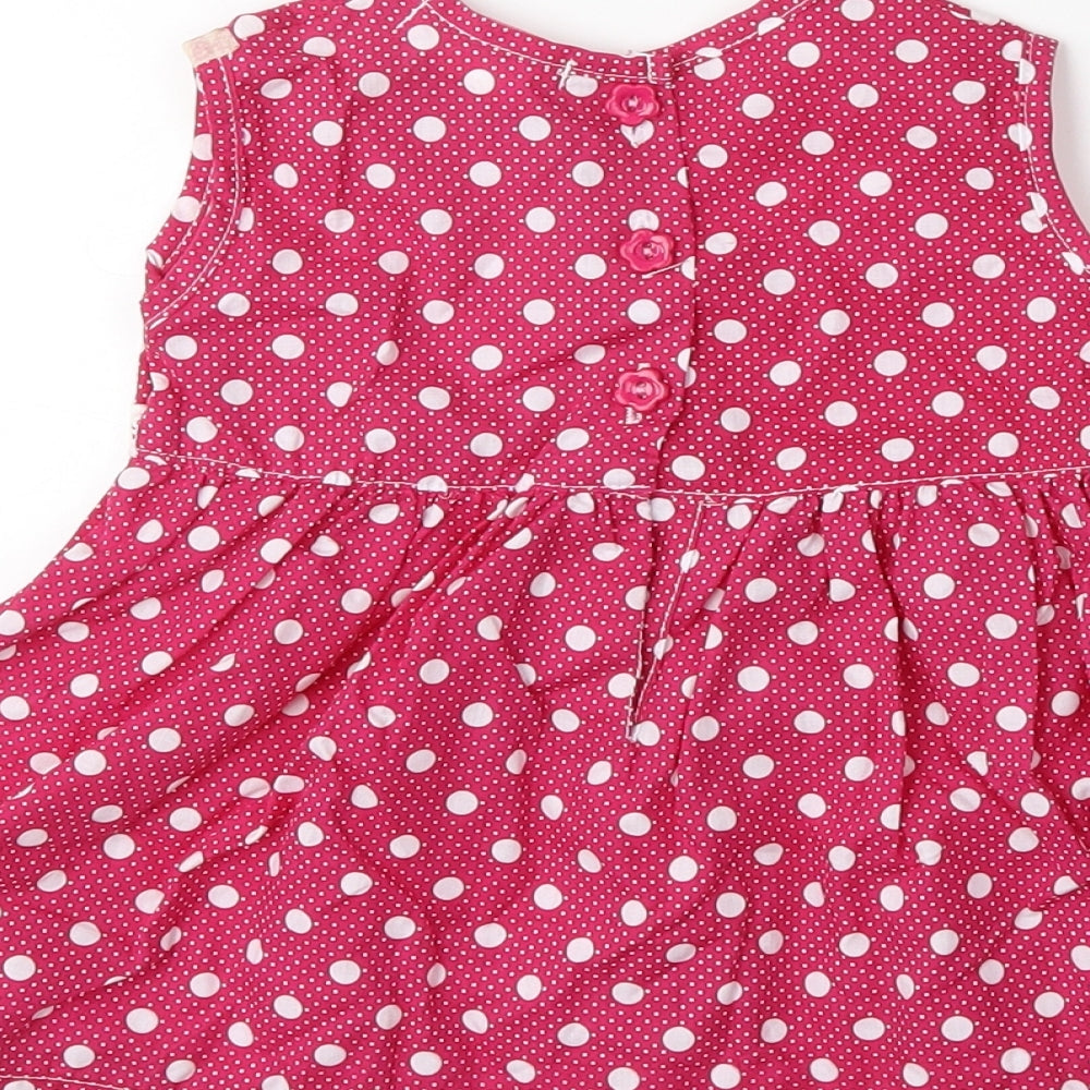 Brand and care label for Isabelle Rose Collection Baby Pink Polka Dot Fit & Flare, size 12-18, Months