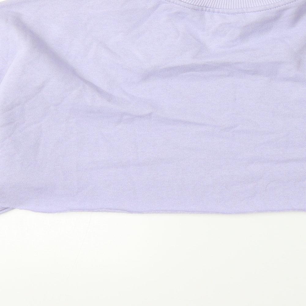 Brand and care label for H&M women’s purple pullover sweatshirt, size S