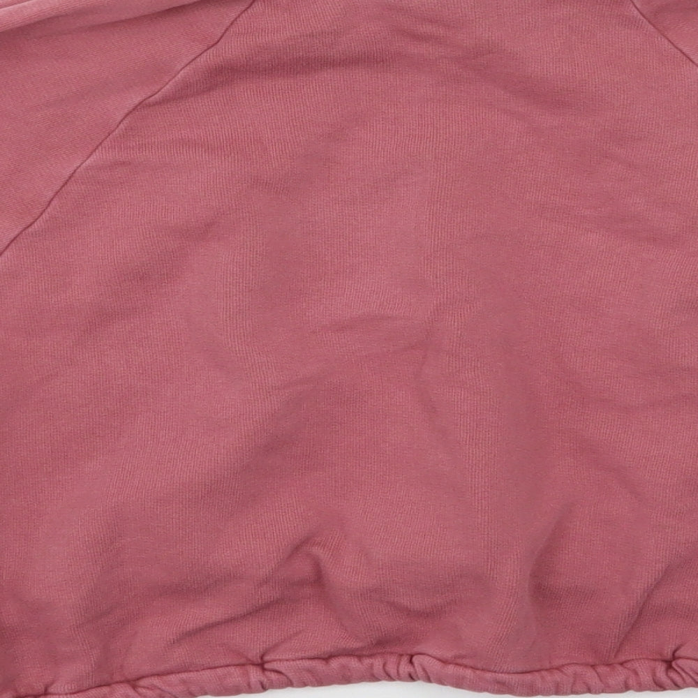 Brand and care label for Next girls’ pink houndstooth jumper, size 9, years