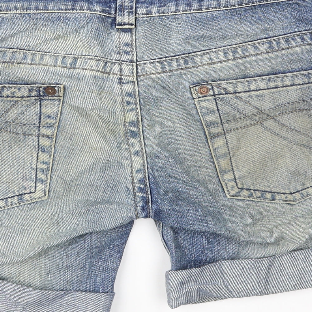 Brand and care label for Topshop women’s blue denim cut-off shorts, size UK 28, in