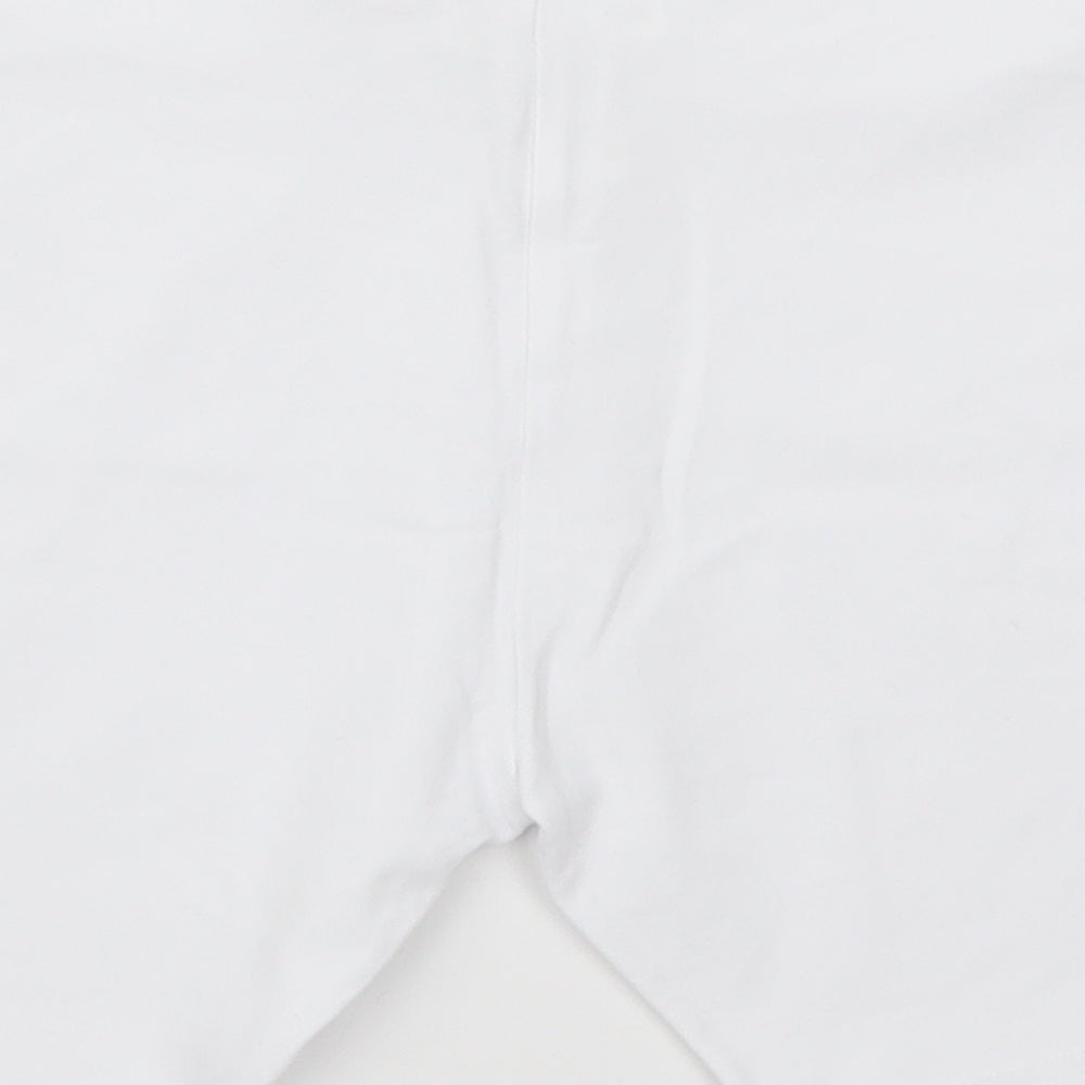 Brand and care label for Next girls’ white sweat shorts, size 13, years