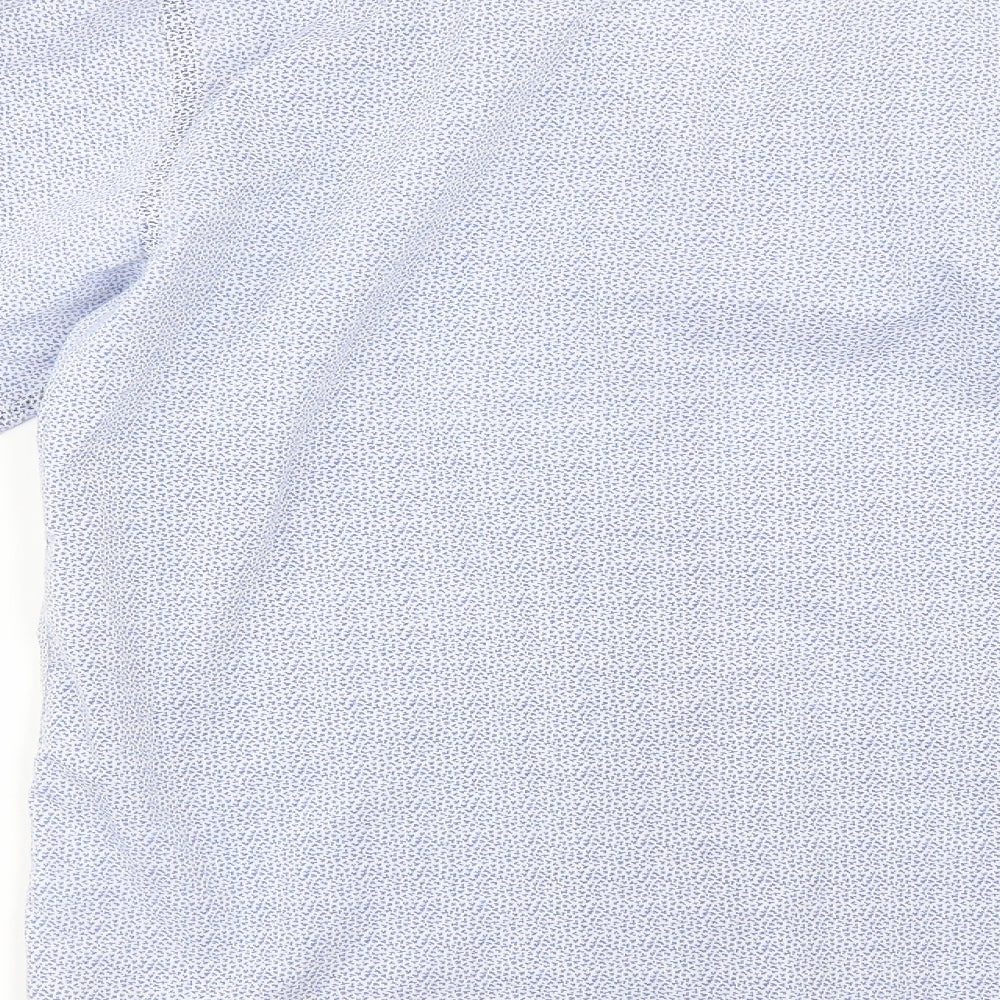 Brand and care label for Primark men’s blue floral button-up, size M