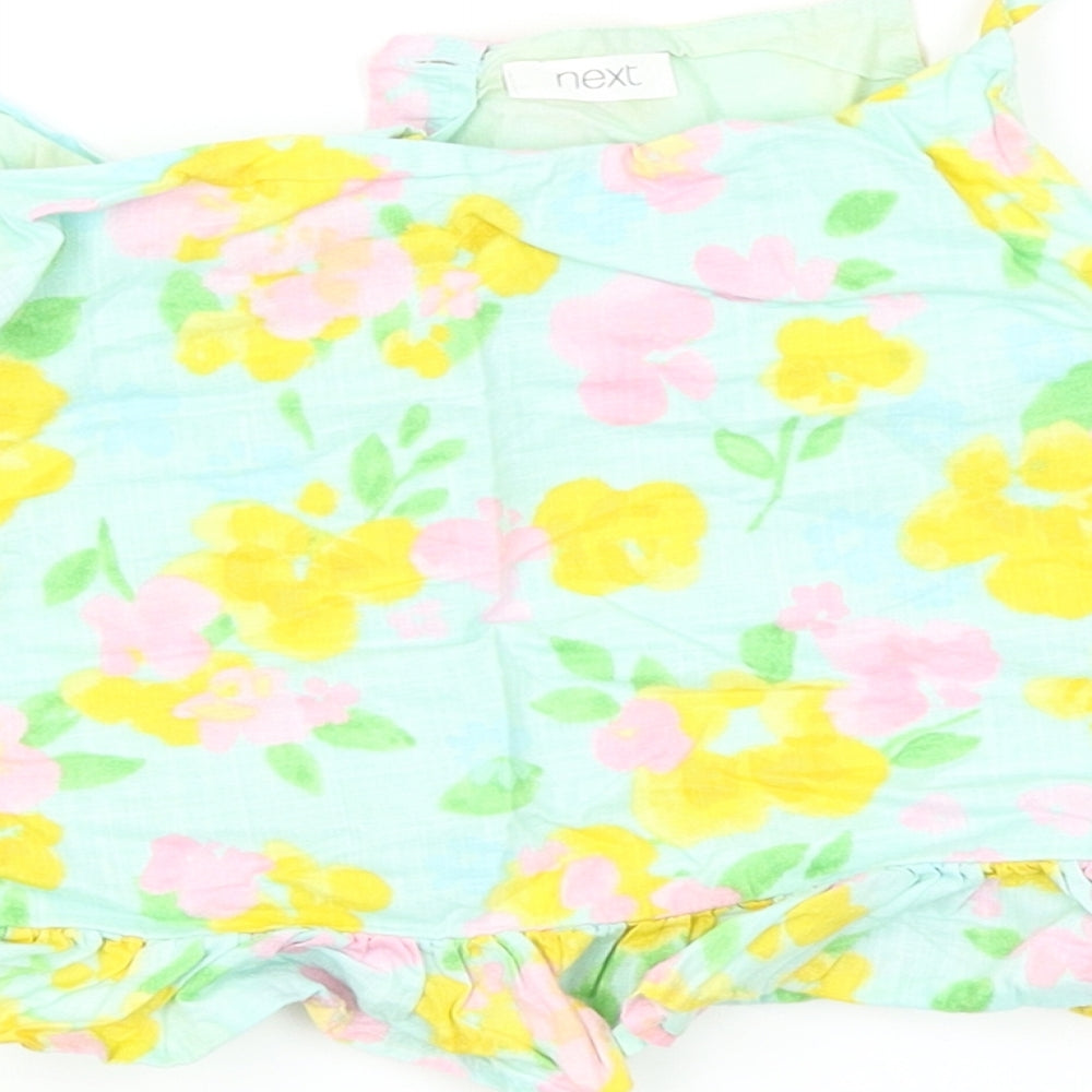 Brand and care label for Next girls’ green floral camisole tank, size 9, years