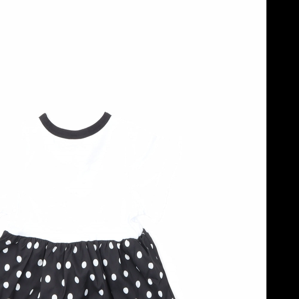 Brand and care label for Preworn girls’ multicoloured polka dot t-shirt dress, size 6-9, months