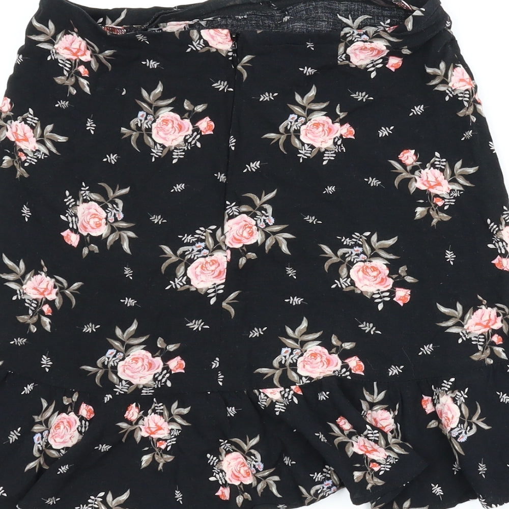 Brand and care label for Divided women’s black floral a-line skirt, size UK 6