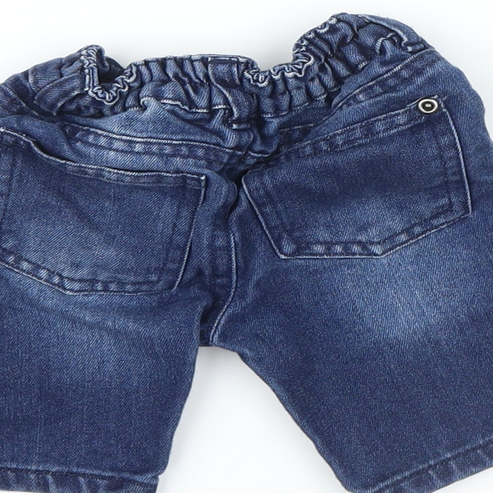 Brand and care label for Primark boys’ blue denim capri jeans, size 9-12, months