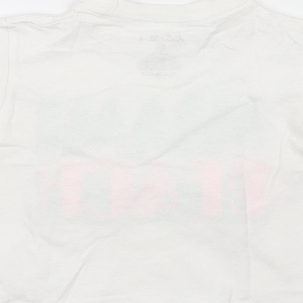 Brand and care label for Alrin's Island boys’ white basic t-shirt, size 2, years