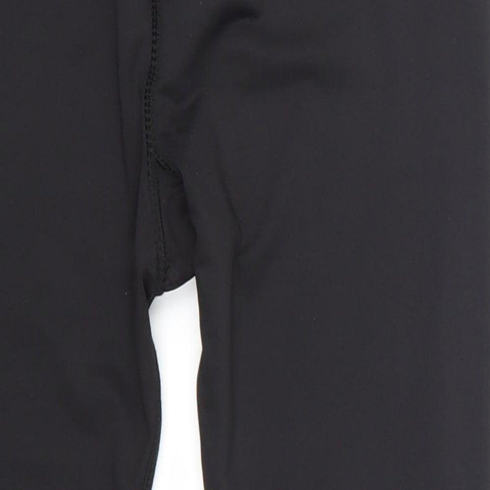 Brand and care label for WorkOut women’s black cropped leggings, size UK 10