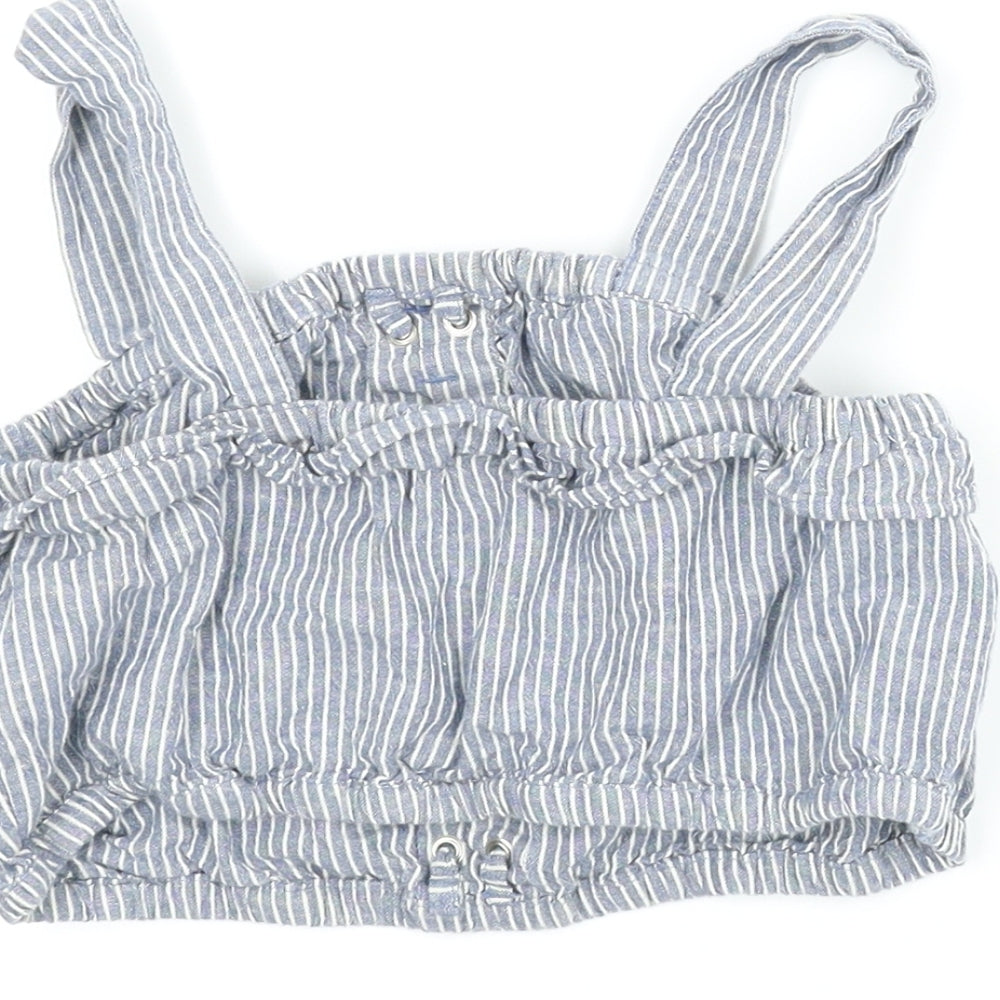Brand and care label for Next girls’ blue striped cropped tank, size 7, years