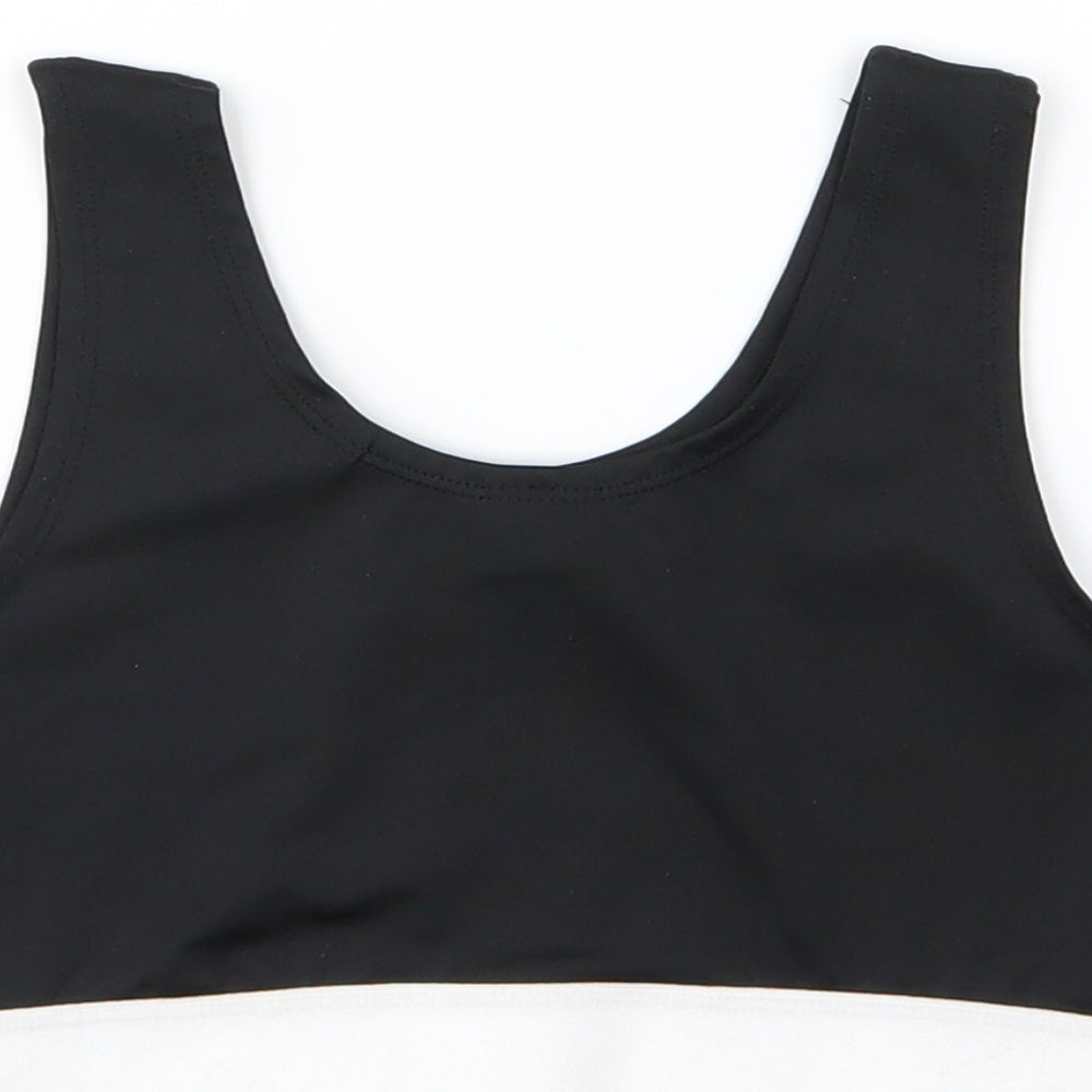 Brand and care label for Skinnyfit girls’ black cropped tank, size 9-10, years