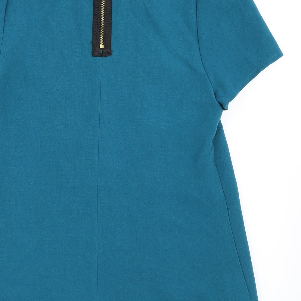 Brand and care label for ASOS women’s blue basic blouse, size UK 4