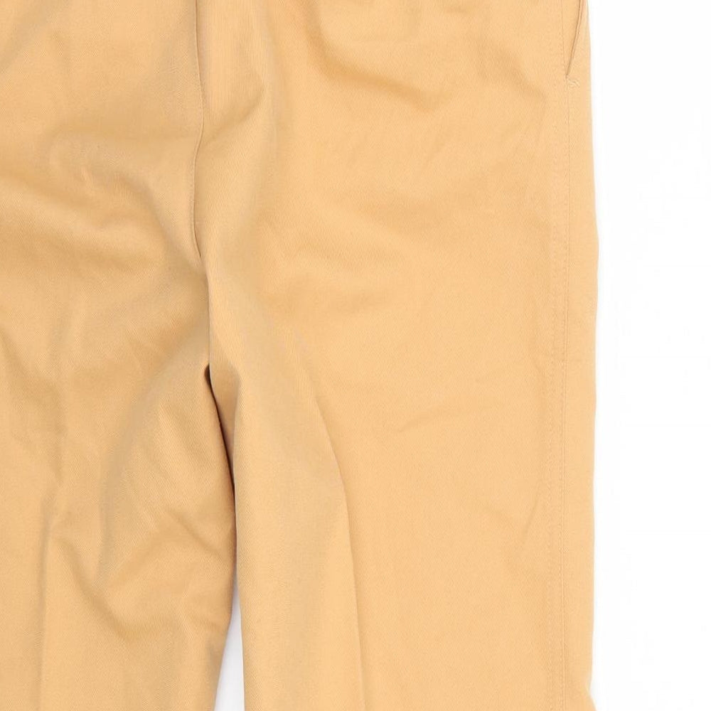 Brand and care label for Uniqlo women’s orange trousers, size UK 27, 26-inch leg