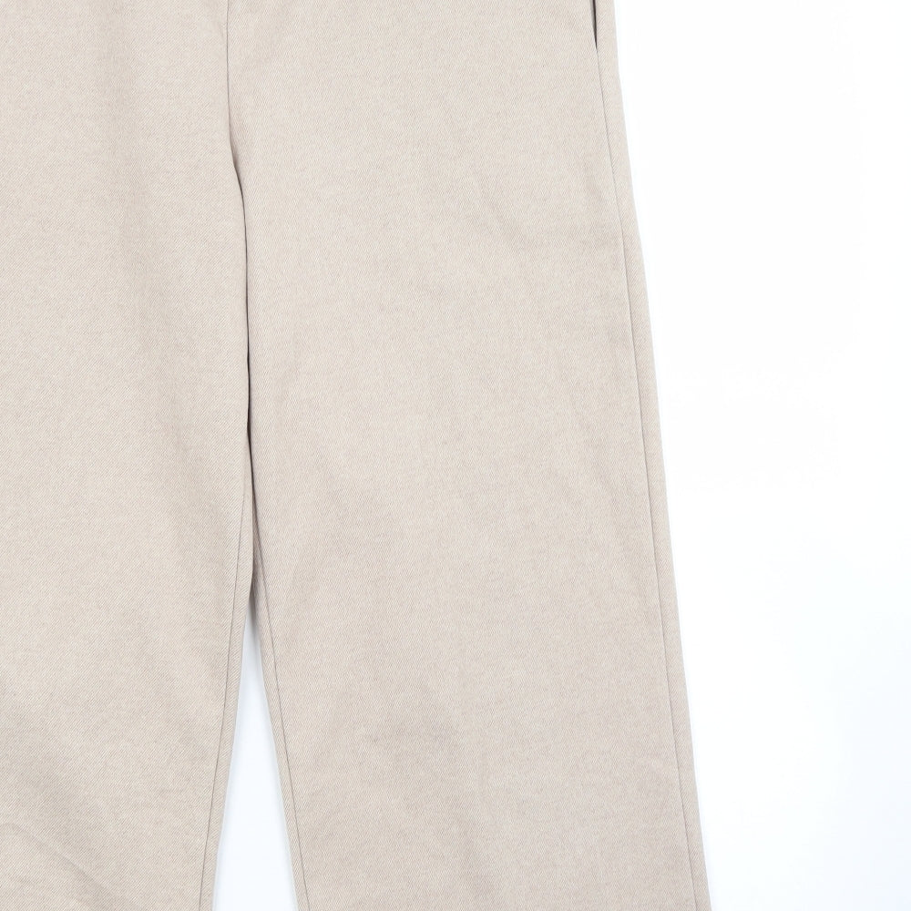 Brand and care label for Little forrest women’s beige jogger trousers, size M, 23-inch leg