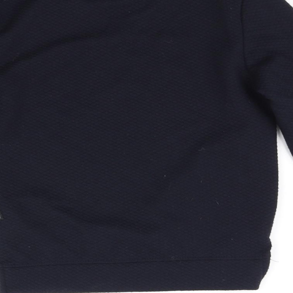 Brand and care label for Primark girls’ blue jumper, size 8-9, years