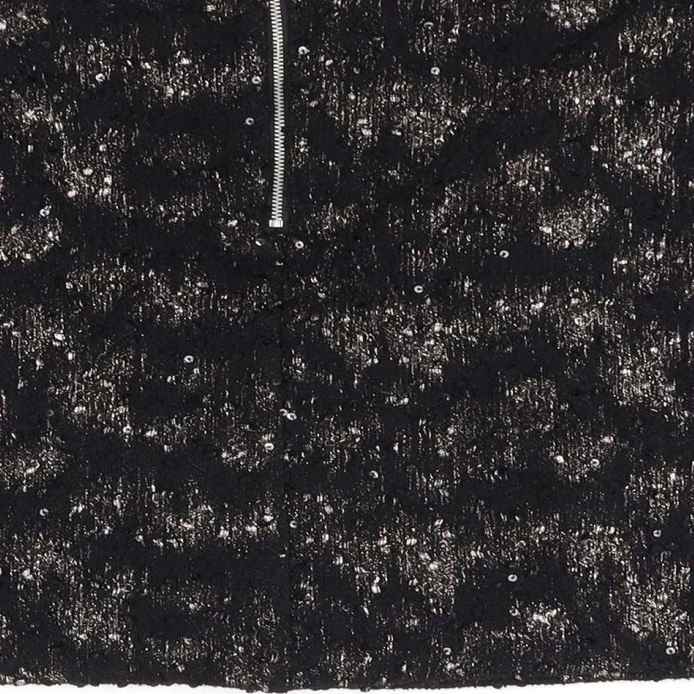 Brand and care label for Next women’s black houndstooth flare skirt, size UK 10