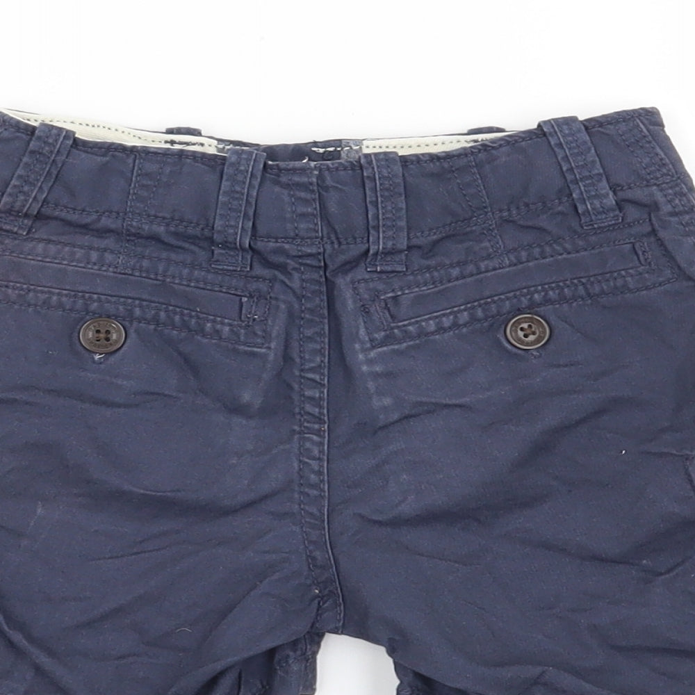 Brand and care label for Gap boys’ blue cargo trousers, size 12-18, months