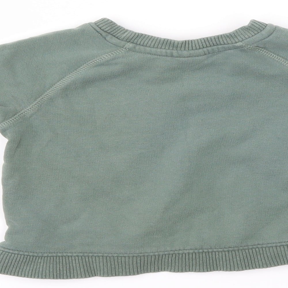 Brand and care label for Mini Club boys’ green jumper, size 12-18, months