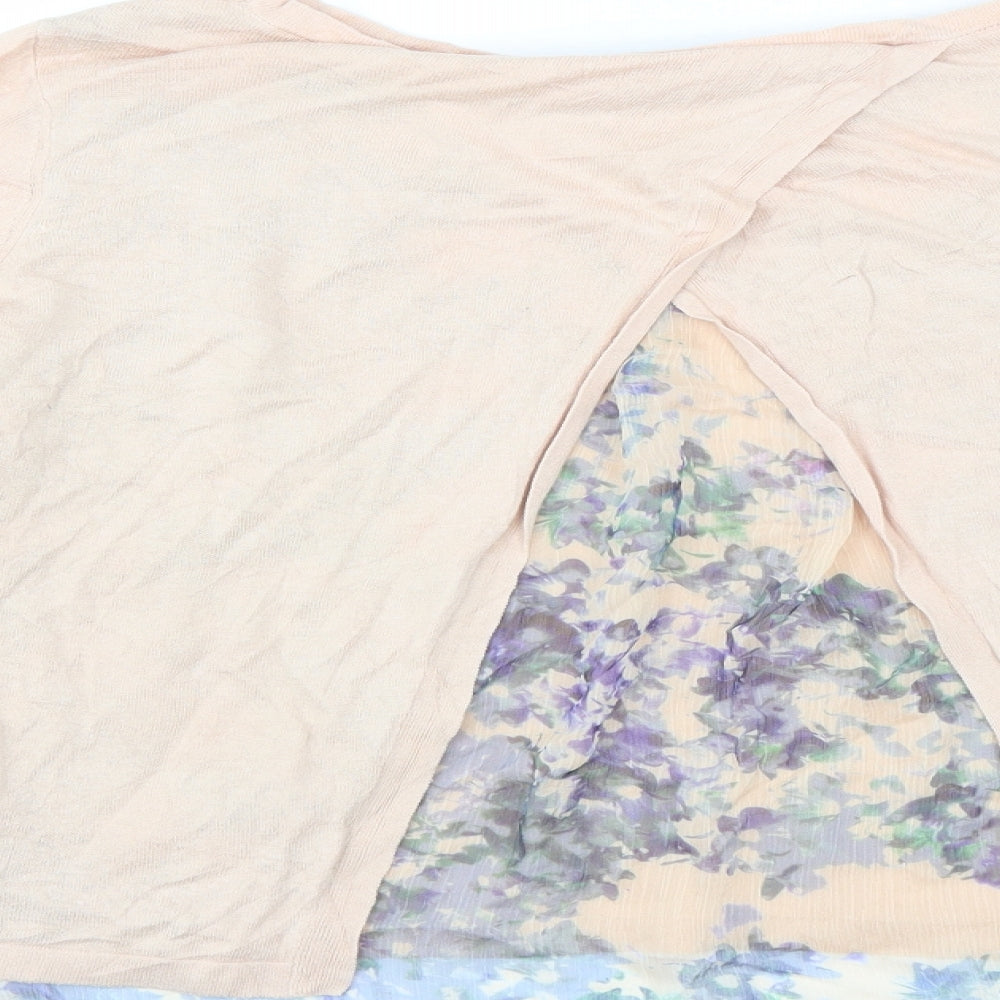 Brand and care label for MINUET women’s pink jumper, size M, - open back detail