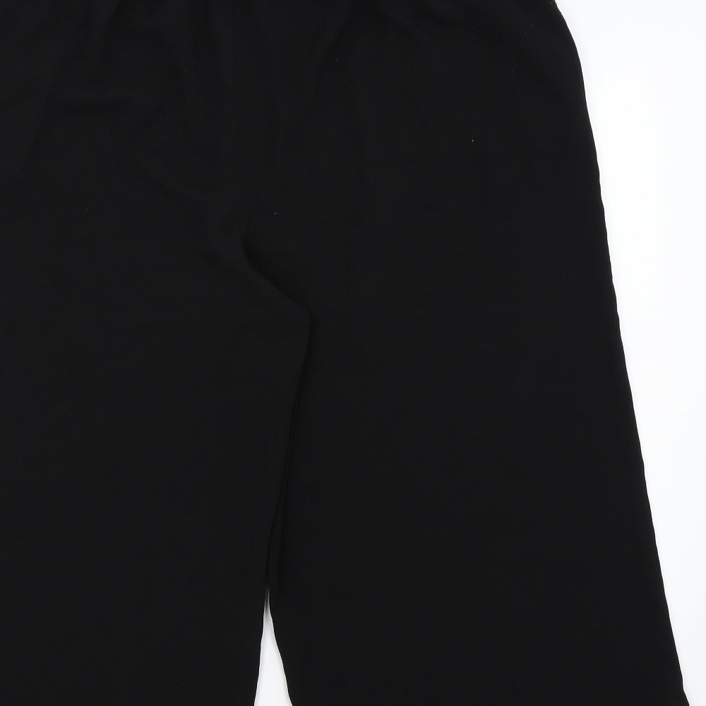 Brand and care label for New Look women’s black capri trousers, size UK 18