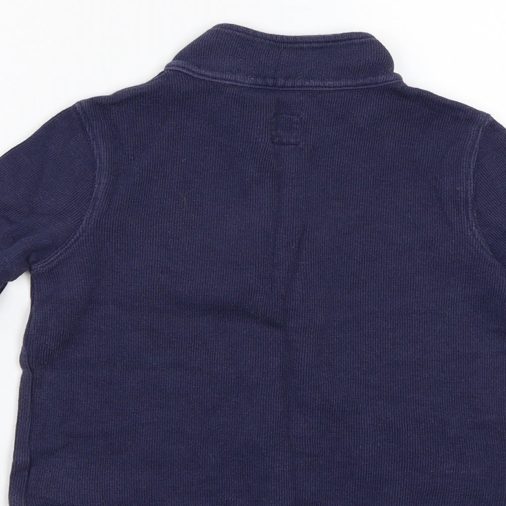 Brand and care label for Gap Kids boys’ blue basic t-shirt, size XS