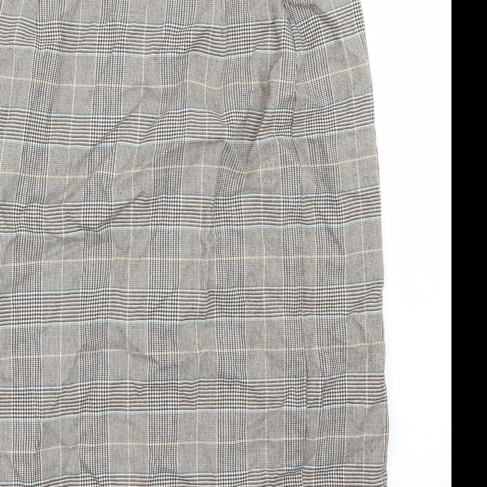 Brand and care label for Marks & Spencer women’s brown a-line skirt, size UK 8