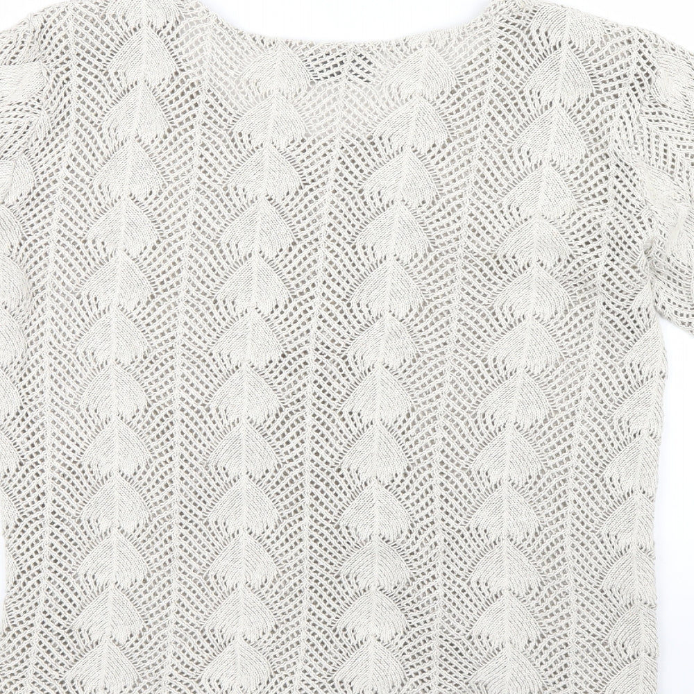 Brand and care label for andrita women’s beige jumper, size M