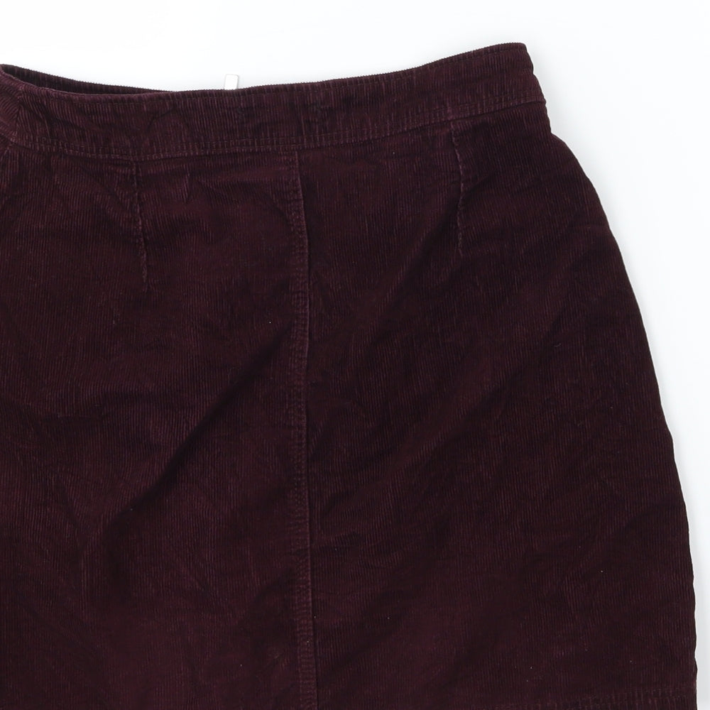 Brand and care label for New Look women’s purple corduroy a-line skirt, size UK 6
