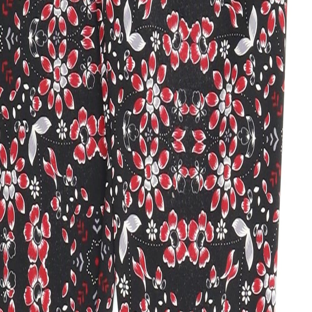 Brand and care label for Bethany Mota women’s black floral carrot leggings, size XS, 28-inch leg